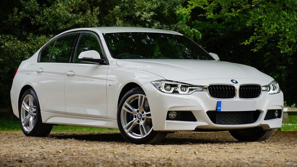 BMW car, white car, on gravel, nature setting, outdoors